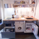 fully equipped kitchen, opened doors